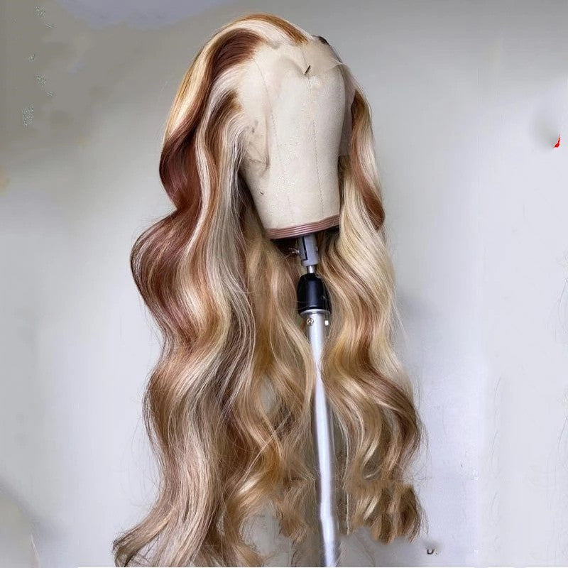 Long wavy brown blonde human hair wig displayed on a mannequin head for styling options