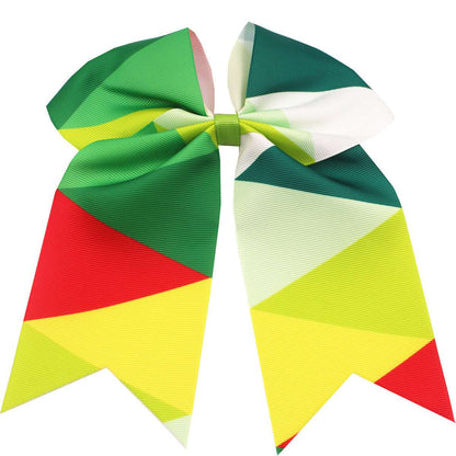 Colorful children's rainbow hair accessories with a large bow in vibrant geometric patterns