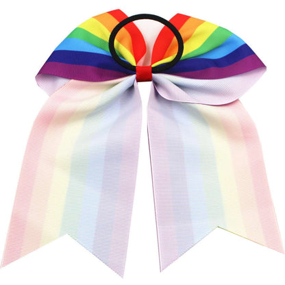 Colorful children's rainbow hair accessories with a vibrant bow and long ribbons for playful hairstyles