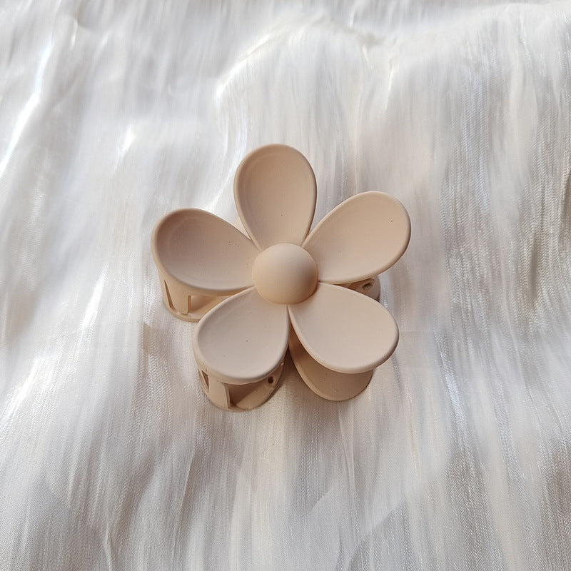 Beige summer candy color frosted colorful flower hair clip with five petals on white fabric