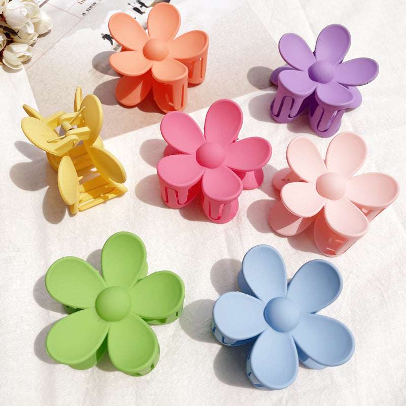 Colorful flower hair clip set in pastel shades including pink, purple, blue, green, yellow, and orange