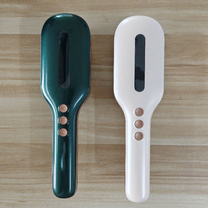 Electric massage hair comb in green and white with ergonomic design and control buttons for relaxation