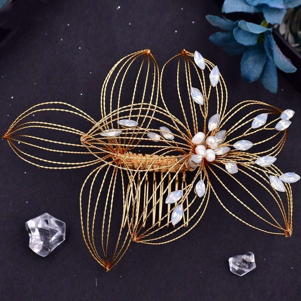 Antique bridal headdress featuring an elegant leaf design hair comb with gold wire and pearl accents