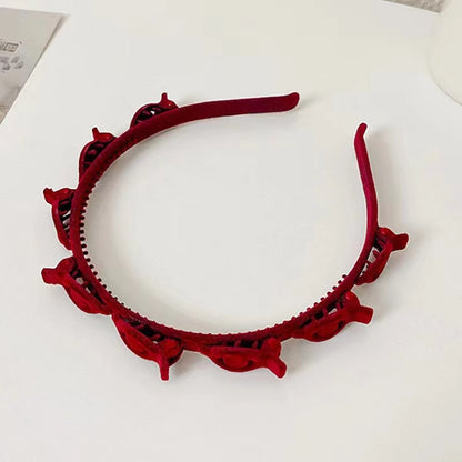 Red finishing hair clip designed for securing broken hair and adding style to your look