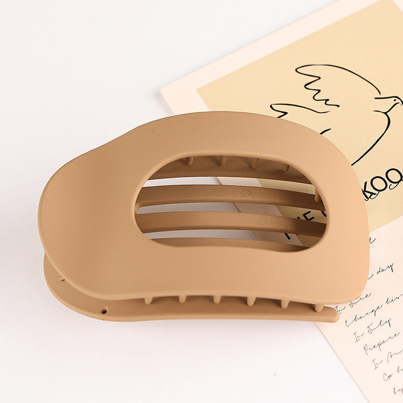 Beige flat oval hair barrette with open slats for back head updo hairstyles
