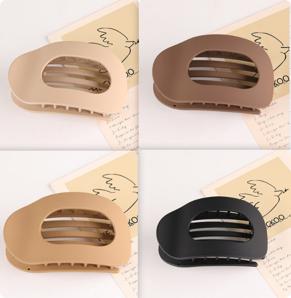 Set of flat oval hair barrettes in beige brown tan and black for back head updo styling
