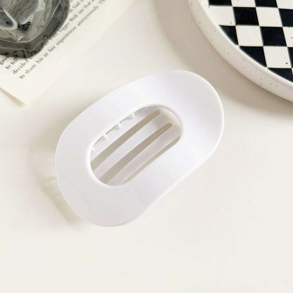 White flat oval hair barrette with a smooth finish for back head updo hairstyle