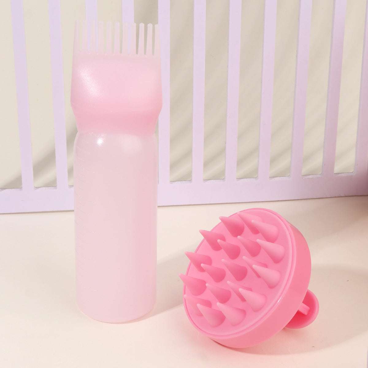 Pink bottle and scalp massage brush hair care tool set for head cleaning and scalp stimulation