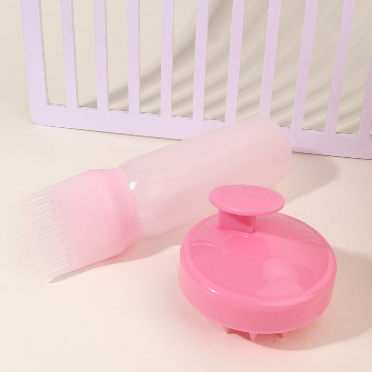 Pink bottle and scalp massager hair care tool set for effective head cleaning and massage
