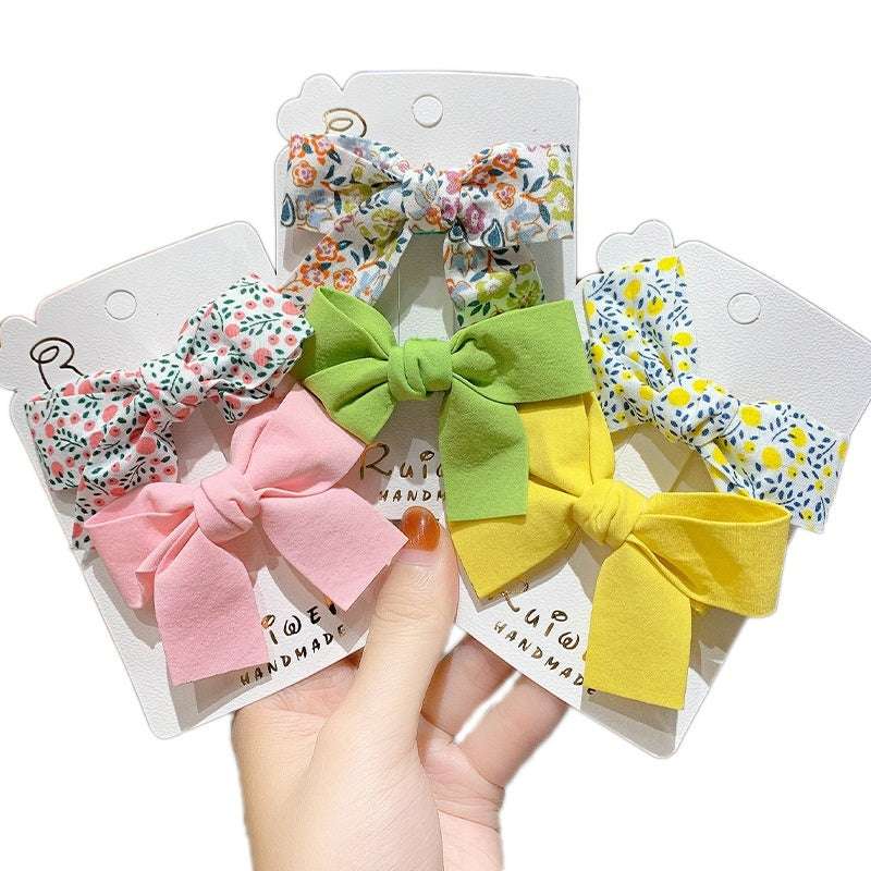 Set of four luxury children's hairclips in floral and bow designs for stylish girls