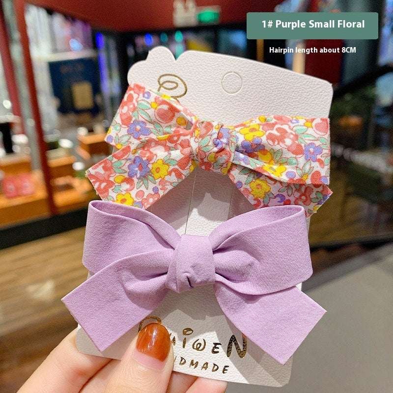 Luxury children's hairclips featuring purple and floral bow barrettes for girls