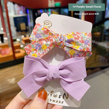Luxury children's hairclips featuring purple and floral bow barrettes for girls