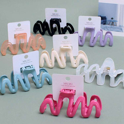 Back Shape Mosquito Coil Hair Combs in various colors, perfect luxury hair accessories for stylish looks
