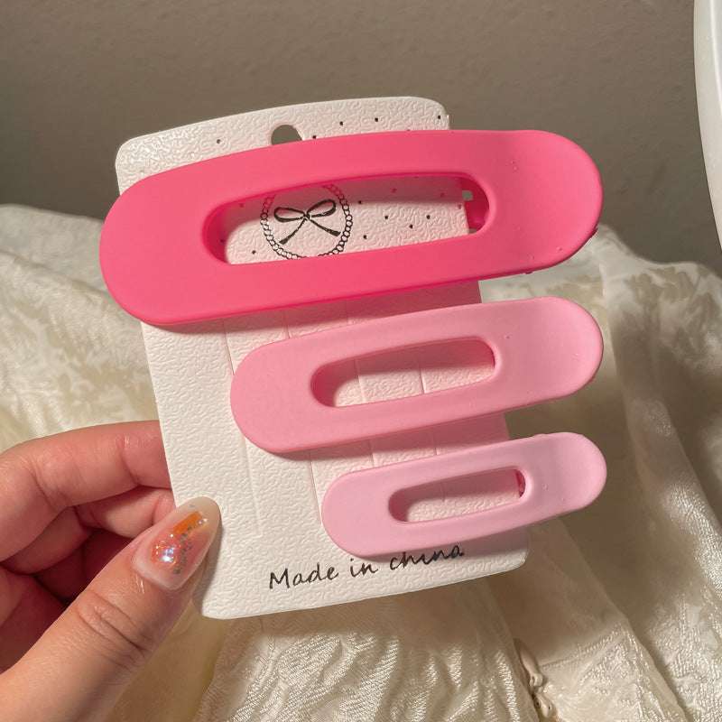 Set of pink Back Shape Mosquito Coil TT Comb Hair Clips featuring a heart-shaped hairclip design