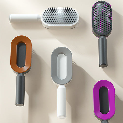 Assorted one-key cleaning hairbrushes in various colors and styles for easy hair maintenance