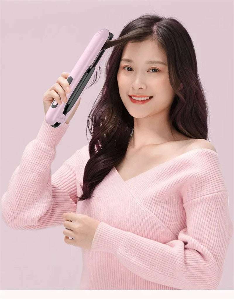 Woman using a portable cordless hair straightener for sleek styling and easy hair management