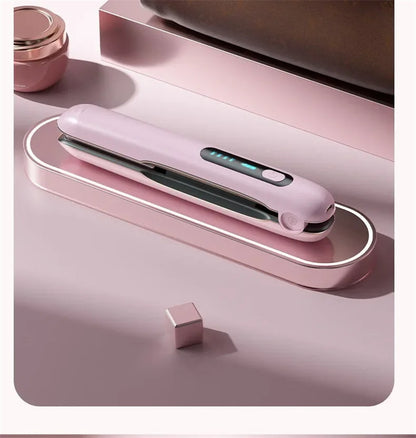 Portable cordless hair straightener in pink design on a stylish surface for on-the-go styling