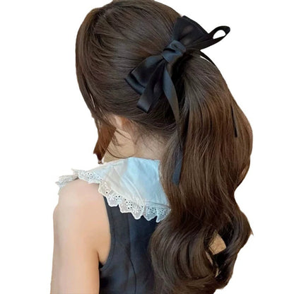 Elegant hairstyle featuring premium French barrettes for women with a stylish black bow