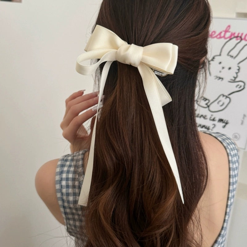 Elegant hairstyle with a cream bow featuring premium French barrettes for women for a stylish look