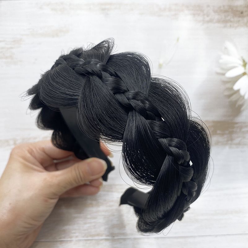 Premium plaited headband women in black with a stylish braided design for versatile hairstyles