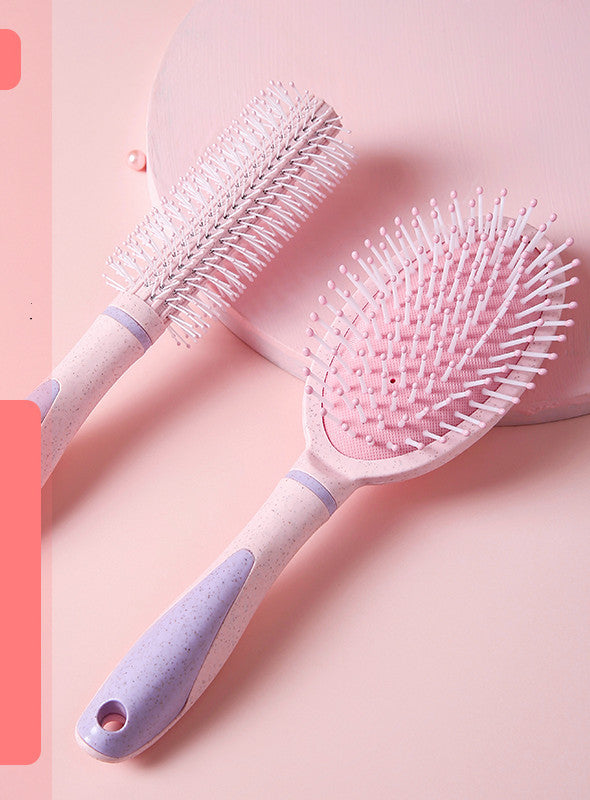 Professional airbag comb set with pink handles featuring a round brush and paddle brush for personal wash