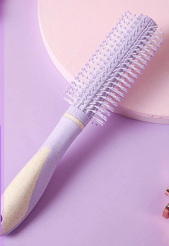 Professional airbag comb with ergonomic handle and round bristles for gentle hair detangling