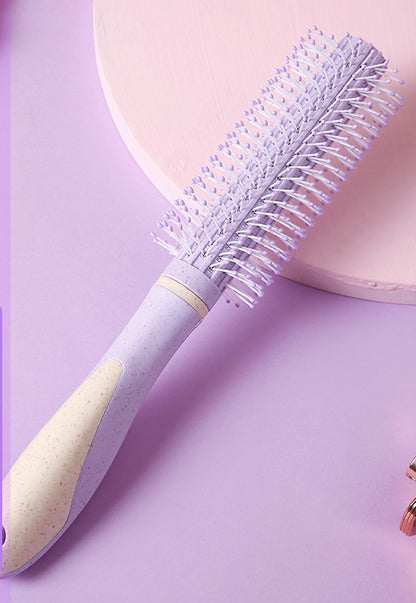 Professional airbag comb with ergonomic handle and round bristles for gentle hair detangling