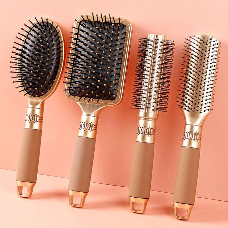 Set of four household airbag comb massage hair tools in gold and brown, professional hair comb tools