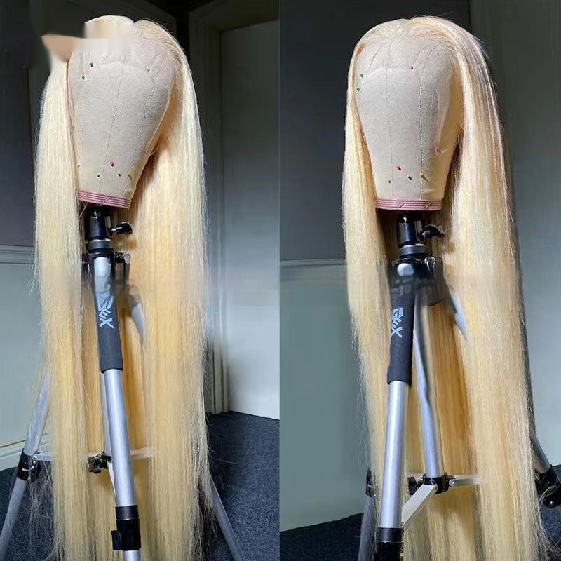 Real human hair transparent lace wig displayed on a mannequin head with long straight blonde hair