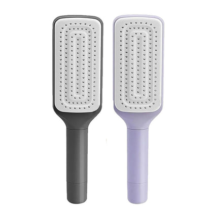 Self cleaning hair brush in black and purple with ergonomic handle for easy grooming