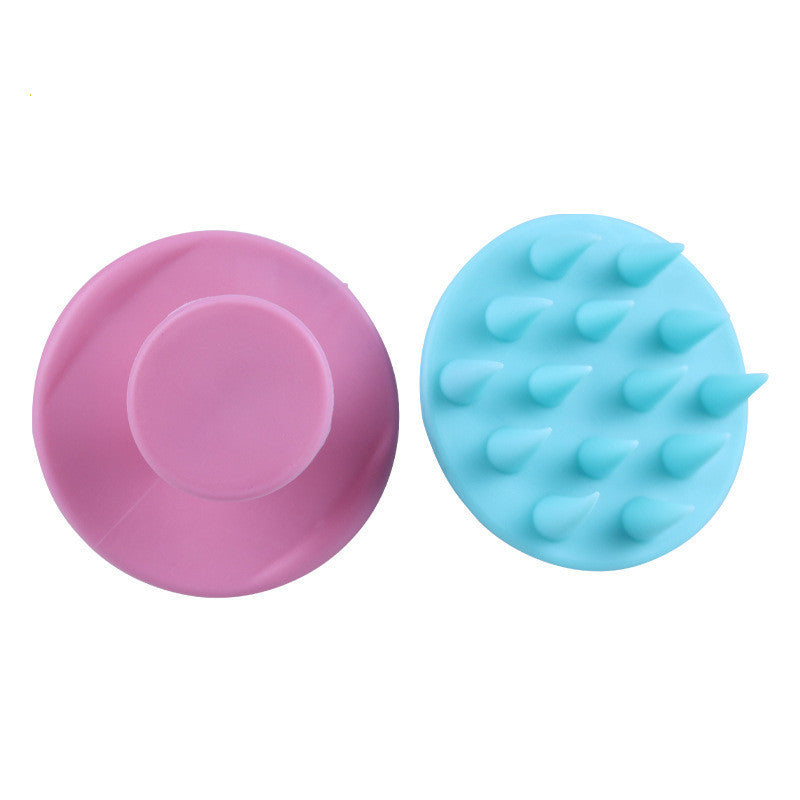 Silicone shampoo brush in pink and blue for scalp massage and effective hair cleansing