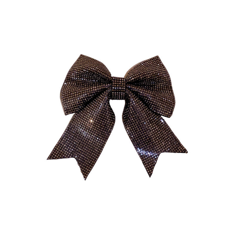 Back Shape Mosquito Coil TT Comb Hair St sparkling hair clip with a large bow and shimmering design