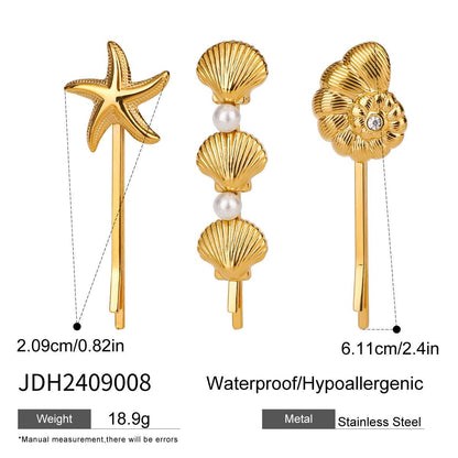 Elegant titanium steel hair barrette featuring starfish and shell designs with a pearl accent