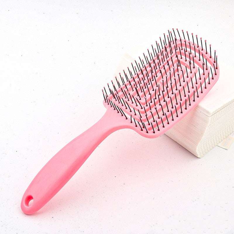 TT hair styling comb in pink designed for easy detangling and smoothing hair